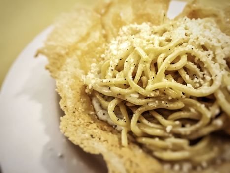 Traditional Italian cheese and pepper (cacio e pepe) pasta. Restaurant and food concept