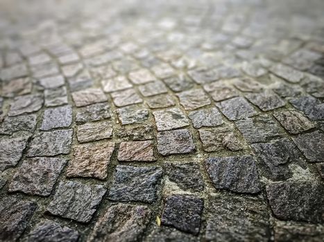 Detail of a cobblestone street. Blurred deep of field