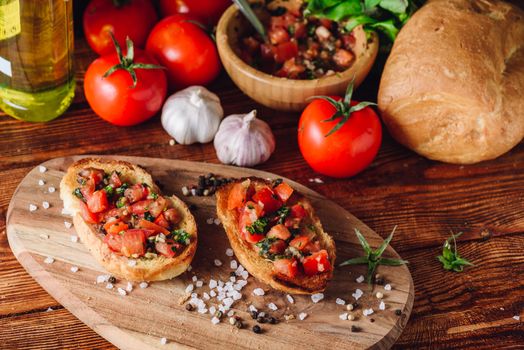 Two Bruschetta with Tomatoes and Other Ingredients. High angle view.