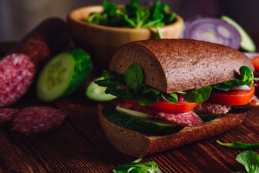Sandwich with Rye Bread, Cheese and Fresh Vegetables. Close up.