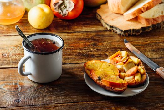 Fruit Bruschettas with Tea in Metal Mug with Ingredients on Background