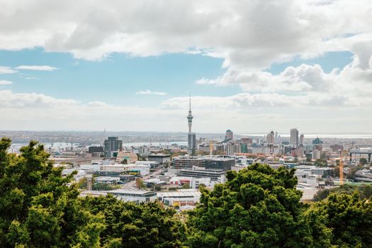 Auckland view from Mt Eden with a person walking along the path towards the city, New Zealand