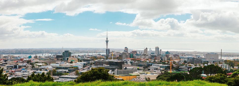 Auckland view from Mt Eden with a person walking along the path towards the city, New Zealand