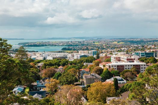 Auckland view from Mt Eden with a person walking along the path towards the city, New Zealand