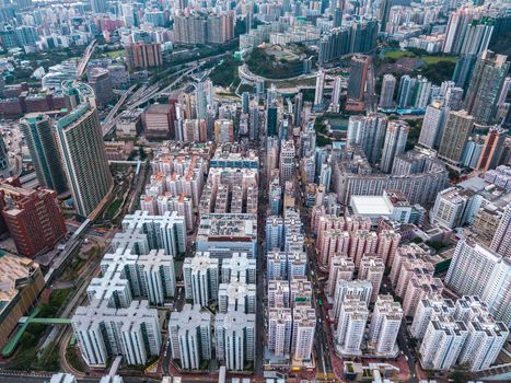 Top view aerial photo from flying drone of a HongKong Global City with development buildings, transportation, energy power infrastructure. Financial and business centers in developed China town