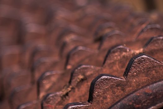 Closeup of a rusty old roller farm equipment