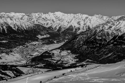 A village surrounded by mountains during winter