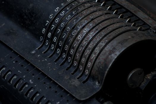 Closeup of an old vintage cash register with lots of numbers