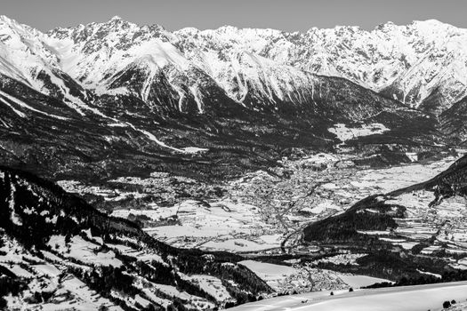 A village surrounded by mountains during winter