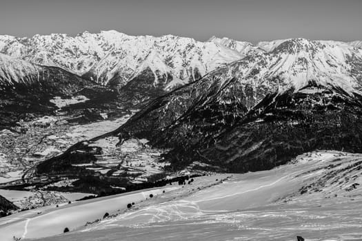 A village surrounded by mountains during winter