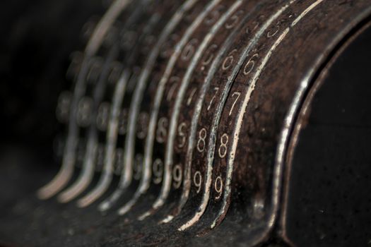 Closeup of an old vintage cash register with lots of numbers