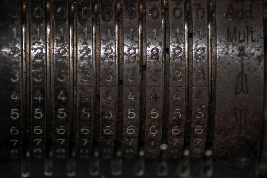 Closeup of an old vintage cash register with lots of numbers