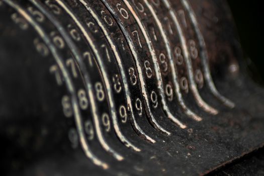 Closeup of an old vintage cash register with lots of numbers