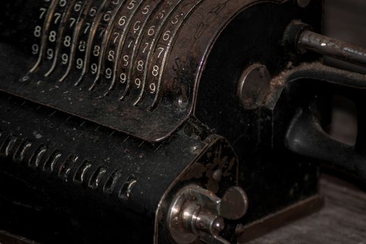 Closeup of an old vintage cash register with lots of numbers