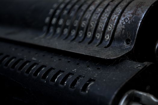 Closeup of an old vintage cash register with lots of numbers