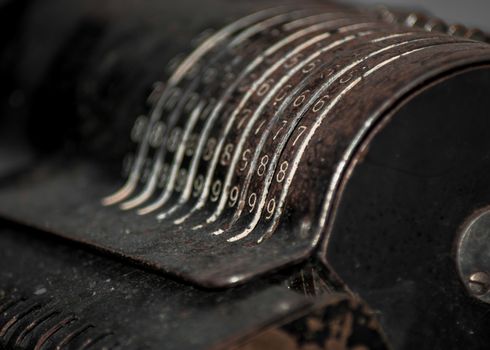 Closeup of an old vintage cash register with lots of numbers