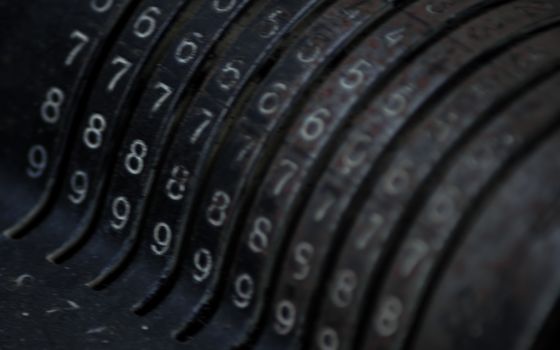 Closeup of an old vintage cash register with lots of numbers