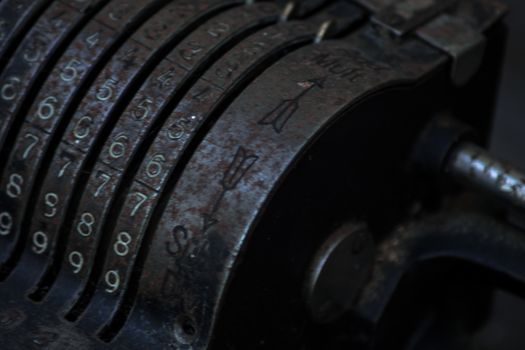 Closeup of an old vintage cash register with lots of numbers