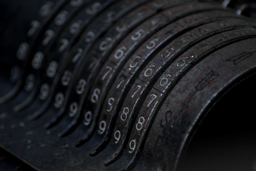 Closeup of an old vintage cash register with lots of numbers