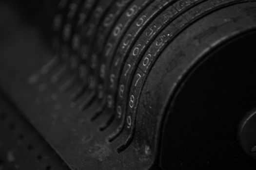 Closeup of an old vintage cash register with lots of numbers