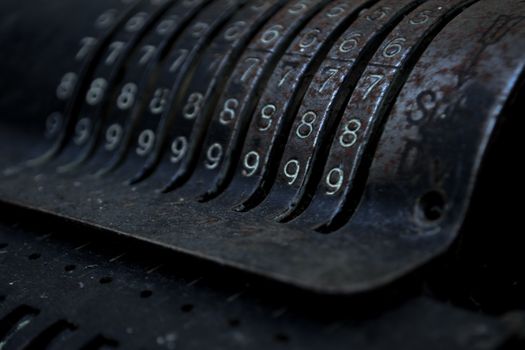 Closeup of an old vintage cash register with lots of numbers