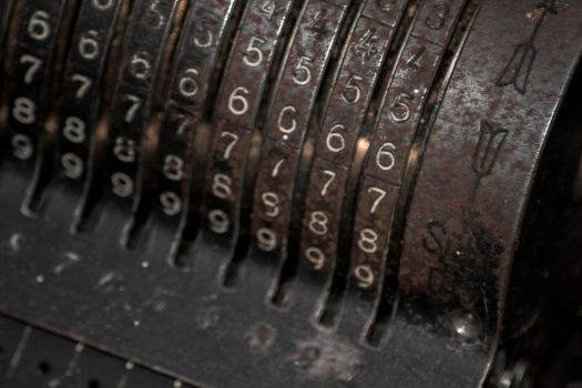 Closeup of an old vintage cash register with lots of numbers