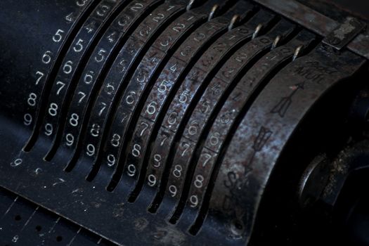 Closeup of an old vintage cash register with lots of numbers