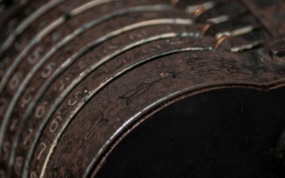 Closeup of an old vintage cash register with lots of numbers