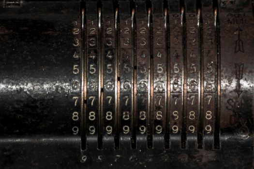 Closeup of an old vintage cash register with lots of numbers