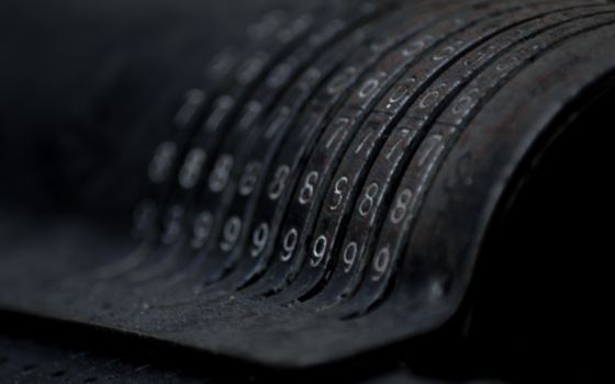 Closeup of an old vintage cash register with lots of numbers