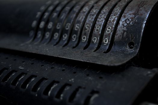 Closeup of an old vintage cash register with lots of numbers