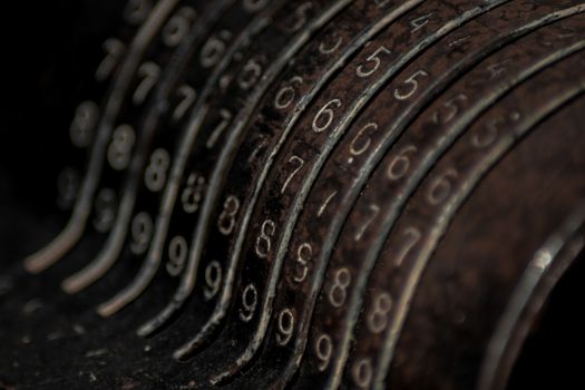 Closeup of an old vintage cash register with lots of numbers