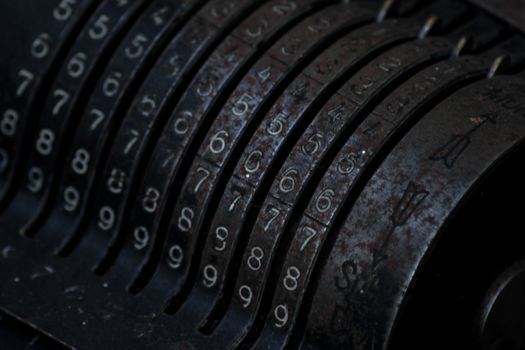 Closeup of an old vintage cash register with lots of numbers