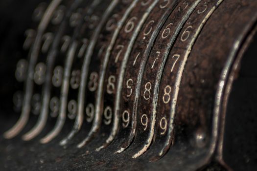 Closeup of an old vintage cash register with lots of numbers