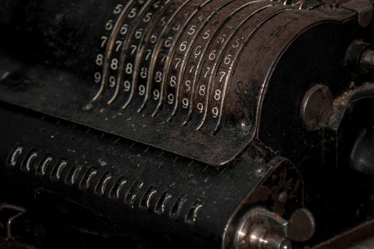 Closeup of an old vintage cash register with lots of numbers