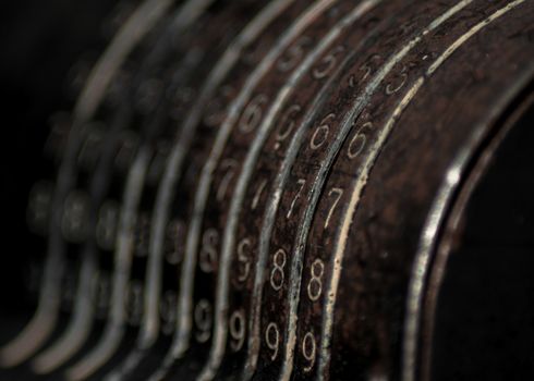 Closeup of an old vintage cash register with lots of numbers