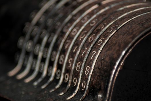 Closeup of an old vintage cash register with lots of numbers