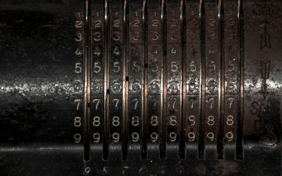 Closeup of an old vintage cash register with lots of numbers