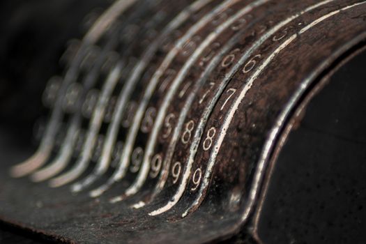 Closeup of an old vintage cash register with lots of numbers