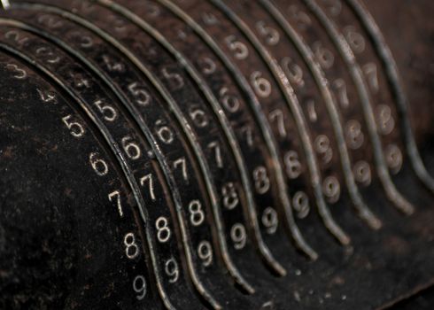 Closeup of an old vintage cash register with lots of numbers