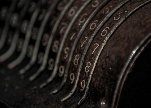 Closeup of an old vintage cash register with lots of numbers