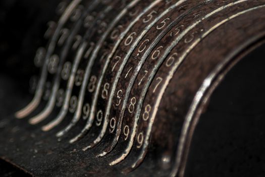 Closeup of an old vintage cash register with lots of numbers