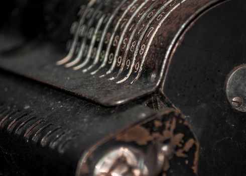 Closeup of an old vintage cash register with lots of numbers