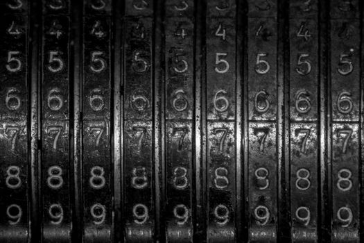 Closeup of an old vintage cash register with lots of numbers