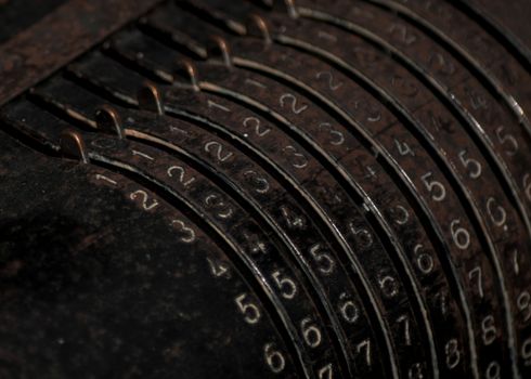 Closeup of an old vintage cash register with lots of numbers