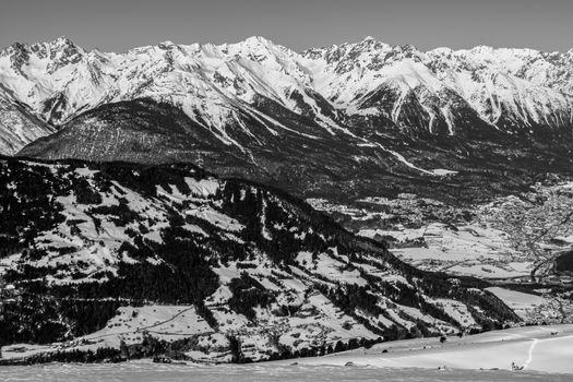 A village surrounded by mountains during winter