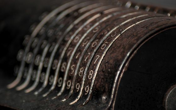 Closeup of an old vintage cash register with lots of numbers