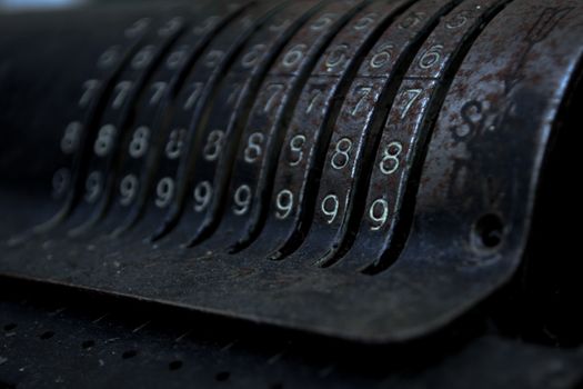 Closeup of an old vintage cash register with lots of numbers