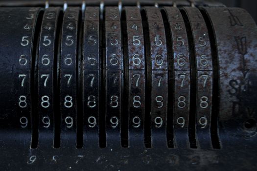 Closeup of an old vintage cash register with lots of numbers