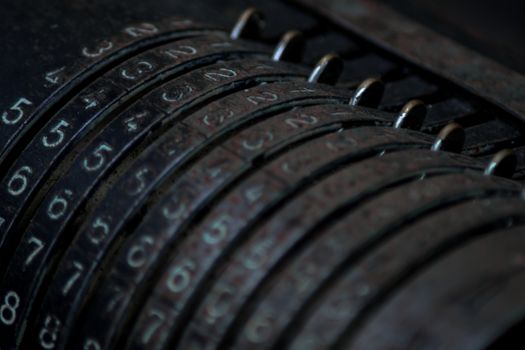 Closeup of an old vintage cash register with lots of numbers